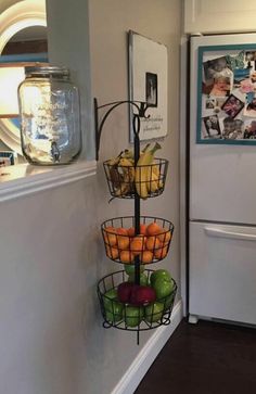 there is a fruit stand in the kitchen