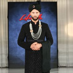 Description A sherwani is the perfect way to show off your sense of style and sophistication on your wedding day. Customize this black short sherwani for groom to look gorgeous on your special wedding day. This custom black sherwani was presented at the London Lifestyle Show and was a crowd favorite. This black short groom sherwani package is perfect combination for groom wedding wear.This black short sherwani is made from premium quality fabric and hand embellished. This sherwani comes with lon Black Sherwani For Groom On Eid, Black Bandhgala For Groom With Traditional Drape, Elegant Black Kurta For Groom, Elegant Black Sherwani With Traditional Drape, Black Bandhgala With Zari Work For Groom, Black Traditional Wear For Groom On Eid, Traditional Black Kurta For Groom, Traditional Drape Black Kurta For Groom, Black Traditional Drape Sherwani For Party