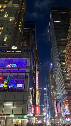 the city is lit up at night with neon signs and buildings in the foreground