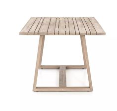 a small wooden table sitting on top of a white floor with no one around it