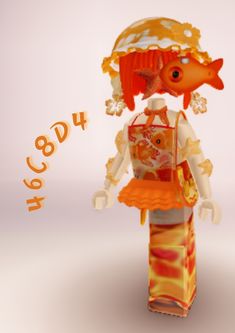 a paper doll with an orange hat and dress