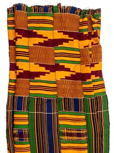 Admire the rich colorful beauty of this authentic vintage Ghanaian Kente Cloth. Woven from cotton, handmade textiles such as this play a central role in the artistic tradition of many West African countries where they are traditionally worn as clothing. Kente cloths are made by the Akan people and were traditionally used solely for royal courts and prestigious occasions. Look carefully and you will see that each piece has its own unique and distinctive pattern. This colorful and vibrant fabric can be used for all kinds of unique design projects. Use it as a table cloth, wall hanging, to make custom clothes, or simply as a colorful accent for your favorite room. This cloth measures approximately 40-44 x 71-75" and is one of a kind. You will receive the exact cloth shown in the photograph! Bohemian Cotton Traditional Wear With Handloom Detail, Bohemian Cotton Handloom Traditional Wear, Bohemian Handloom Cotton Traditional Wear, Multicolor Folk Traditional Wear With Woven Motifs, Multicolor Folk-style Traditional Wear With Woven Motifs, Multicolor Cotton Traditional Wear With Woven Motifs, Folk Style Cotton Traditional Wear For Ceremonies, Traditional Brown Cotton Wear, Multicolor Cotton Traditional Wear