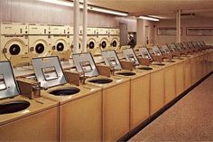 rows of washers and dryers lined up in a row