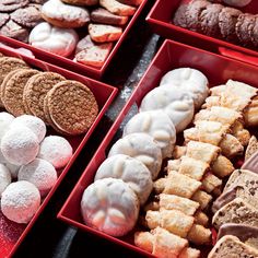 assorted pastries and desserts displayed in red boxes