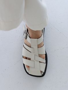 Editor's NotesThese sandals feature simple design and light weight. It is good to wear for various activities. - Silver buckle point- Unique strap- Summer shoes- Daily item- Goes well with any casual looksMeasurements(in.)- Size: KR 225MM(US 5.5) ~ KR 255MM(US 8.5)- Heel Height: 1.57 in.*Fits true to size.Composition & Care- Upper: Cowhide- Sole: Rubber- Please check the care labelDesigner- by MOL:pin White Leather Sandals For Everyday, Everyday White Leather Sandals, Modern White Everyday Sandals, Modern Sandals With Rubber Sole For Everyday, White Round Toe Sandals For Everyday, Everyday White Round Toe Sandals, Summer Leather Sandals, Shoes World, Classic Shoes