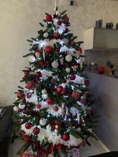 a christmas tree decorated with red and white ornaments