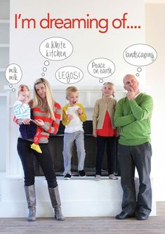 a group of people standing next to each other in front of a wall with words on it