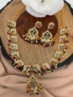 Hyderabadi Jadau Navratan Short Necklace Multicolor Bridal Necklace With Latkans For Festive Occasions, Multicolor Latkans Necklace For Festive Occasions, Multicolor Necklaces With Latkans For Festive Occasions, Multicolor Necklaces With Latkans For Gifts, Gift Multicolor Necklaces With Latkans, Elegant Multicolor Latkans Necklace, Festive Multicolor Long Necklace, Festive Multicolor Necklace With Latkans, Multicolor Long Kundan Necklace Gift