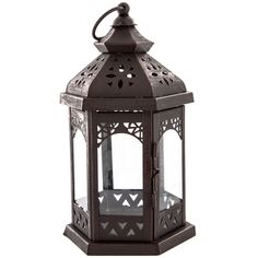 an ornate black metal lantern on a white background