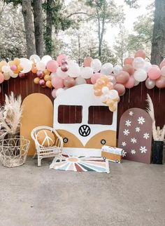 a party setup with balloons and decorations for a vw camper van themed birthday