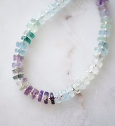 Fluorite is said to absorb and neutralize negative energy & stress. It is also believed to increase concentration, self-confidence, and help in decision-making. This bracelet is handcrafted with genuine Fluorite ranging blues, greens, and purples. Each stone is slightly different in width and has a tiny gold or silver bead between. STONE SIZE: 6mm SIZING: Please measure your wrist to find your size before purchasing. If purchasing as a gift the adjustable size of 6.5 to 7.5" fits most average wo Rondelle Natural Stones Beaded Bracelets For Healing, Healing Rondelle Beaded Bracelets With Natural Stones, Healing Gemstone Beads Bracelet, Fluorite Gemstone Bracelets With Round Beads, Fluorite Natural Stone Beaded Bracelets As Gift, Minimalist Gemstone Beads Crystal Bracelet For Healing, Minimalist Crystal Bracelet With Gemstone Beads For Healing, Handmade Spiritual Fluorite Bracelets, Minimalist Natural Stones Bracelets For Healing