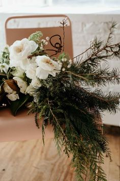 a bouquet of flowers sitting on top of a wooden table