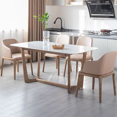 a kitchen table with chairs around it