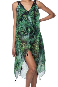 Dive into the summer season with the Moonlight Green Leaf Print Sundress. Perfect for those who love a seamless transition from the tranquility of the poolside to the lively ambiance of a party, this sundress is the epitome of effortless chic. Crafted in a sheer, lightweight fabric, it boasts a beautiful blue hue reminiscent of the ocean, ensuring you carry the essence of the sea wherever you go. Pool to Party One-Size fits most 100% Sheer Soft Hand Poly Made in the USA of Imported Fabrics