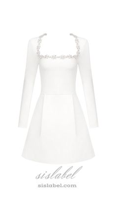 Introducing our stunning jewel-embellished trim mini dress in white! This dress features delicate jewels along the trim, adding a touch of sparkle and sophistication. Its mini length is perfect for showing off your legs and the crisp white color is a timeless choice. Experience luxury and elegance in this dress! - White crepe fabric- Square neckline with a jewel-embellished trim- Shoulder pads- Structured corset boning to the bodice- Pleats to the front and back of the skirt- Concealed zip closure- Fully lined- Structured fit Colour may vary due to lighting on images. The product images (without model) are closest to the true colour of the product.Item runs true to size chart and is cut to suit our size chart. Please refer to our size chart for the best fit. Do not size up or down. Feminine Embellished Mini Dress For Wedding, Feminine Embellished Mini Dress, White Embellished Mini Dress For Wedding, White Crystal Embellished Mini Dress For Cocktail, Elegant Embellished Mini Dress For Wedding, Glamorous White Embellished Mini Dress, Elegant Embellished Wedding Mini Dress, Pearl Embellished Mini Dress For Wedding, White Mini Dress With Rhinestones For Evening