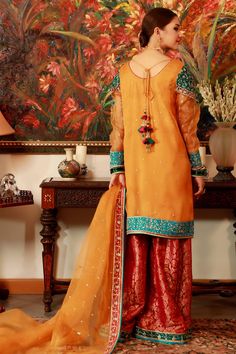 Peela Jora | Ready To Wear Luxury Formal Women Dress Online – Zaaviay Orange Organza Set For Festivals, Orange Organza Festival Set, Festival Orange Organza Set, Formal Organza Kurta For Festivals, Traditional Orange Organza Sets, Yellow Organza Dresses With Dabka Work, Orange Sets With Sheer Dupatta In Organza, Orange Organza Sets With Sheer Dupatta, Organza Kurta With Dupatta For Celebration