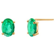 Indulge in elegance with these exquisite 14 Karat Yellow Gold stud earrings, featuring a pair of stunning oval-shaped emeralds. Each emerald is expertly matched and weighs a combined total of 1.30 carats, offering a radiant splash of medium green hue that is both timeless and captivating. The emeralds boast a good crystal clarity, making them an exceptional choice for those who appreciate refined beauty. The earrings measure approximately 0.30 inches long by 0.27 inches wide, perfectly sized for everyday wear or special occasions. Crafted in luxurious 14K yellow gold, the warm tone of the metal complements the lush green of the emeralds, creating a harmonious and elegant design. Whether worn as a signature piece or a thoughtful gift, these emerald stud earrings are sure to leave a lasting Yellow Gold Oval Emerald Earrings, Oval Yellow Gold Emerald Earrings, Oval Emerald Earrings In Yellow Gold, Oval Emerald Gemstone Earrings, Oval Emerald Earrings For May Birthstone, Emerald Oval Earrings For May Birthstone, Fine Jewelry Oval Emerald Earrings, Oval Emerald Earrings With Prong Setting, Emerald Gold Earrings