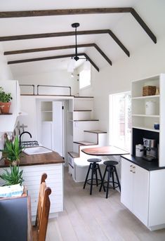 the kitchen is clean and ready to be used as a living room or dining area