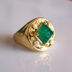 Exquisite Sugar Loaf Emerald & Diamond Ring.  This ring is part of our special one of Temple jewel Creations.   * 18k Solid Gold * Natural Ethically sourced Sugar loaf Columbian Emerald * Diamonds : 4 x 0.03kt Vs Si Brilliant natural Ethically sourced   * Free Worldwide Ensured DHL express shipping to most countries * Sizing included from 5us to 8us Custom orders Welcomed! Luxury Yellow Gold Emerald Ring With Single Cut Diamonds, Green Diamond Signet Ring For Anniversary, Luxury Green Rings With Single Cut Diamonds, Luxury Green Signet Ring For Anniversary, Anniversary Green Diamond Signet Ring, Luxury Hallmarked Emerald Signet Ring, Gia Certified Fine Jewelry Signet Ring For Anniversary, Emerald Rings With Single Cut Diamonds For Anniversary, Luxury Emerald Ring With Single Cut Diamonds For Anniversary