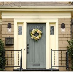 a front door with a wreath on it