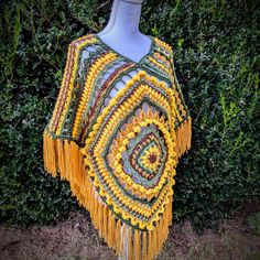 In a world of fast fashion, investing into a handcrafted piece can be rewarding and a better sustainable option.  This is a handmade sunflower poncho crafted with varying stitch types to give it that whimsical boho feel. It also has a hood and tasseled edge.  This is a one of a kind piece, with no plans to remake.   Made with acrylic yarn. Stitch Types, Handmade Sunflower, Sunflower Crochet, Crochet Poncho Patterns, Ladies Poncho, Poncho Pattern, Woodland Fairy, Crochet Poncho, Fast Fashion