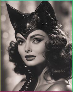 a black and white photo of a woman wearing a cat ears headpiece with glitter on it