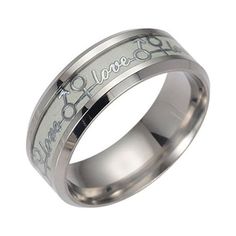 a wedding ring with the words love is forever engraved on it's center and inside