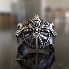 Immerse yourself in the world of Final Fantasy with our stunning Ring of the Lucii. This handcrafted 925 sterling silver piece features the iconic game-inspired design, capturing the essence of the powerful artifact from the beloved series. This unique, unisex ring is perfect for gamers, Final Fantasy fans, or anyone who appreciates intricate and imaginative jewelry. The detailed craftsmanship and polished finish make it a captivating accessory for any occasion. Available in various sizes for me Symbolic Stainless Steel Skull Ring As Gift, Gift Skull Ring In Stainless Steel, Gift Stainless Steel Skull Ring, Round Ring With Steel Shank For Gift, Round Steel Shank Rings As Gifts, Symbolic Handmade Stainless Steel Rings, Handmade Symbolic Stainless Steel Rings, Regis Lucis Caelum, World Of Final Fantasy