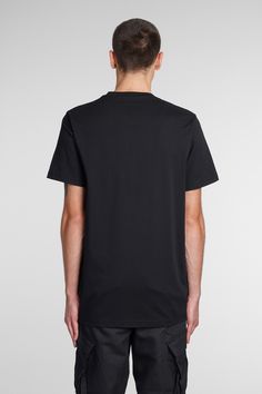 T-Shirt in black cotton, round neck, short sleeves, print on front, 100% cotton, Made in Portugal, Model is 183 cm and wears size L Burberry Shop, Versace Shop, Gogo Boots, Maurice Lacroix, Neil Barrett, John Lobb, Military Inspired, Top Designer Brands, Gorgeous Bags