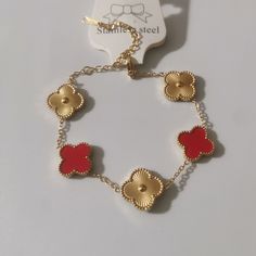 Material: Stainless Steel Fashion Element: Sunflower Style: Fashion OL Luxury Stainless Steel Plated Jewelry, Metal Bracelets With Flower Shape For Gift, Metal Flower-shaped Bracelets As A Gift, Elegant Flower Shaped Metal Jewelry, Elegant Flower-shaped Metal Jewelry, Gold Metal Bracelets With Flower Shape, Luxury Red Metal Bracelets, Gold Flower-shaped Metal Bracelets, Luxury Red Metal Bracelet