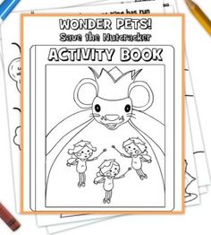 the wonder pets activity book with crayons and pencils on top of it