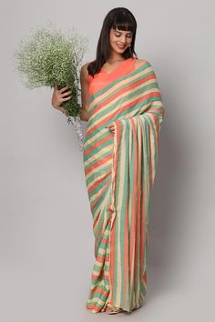 This striped pastel yellow, green, and coral saree is a festive stunner! The sequin work on this saree gives the perfect amount of shine and glam to it - Pair this saree with a sexy coral blouse and some chunky earrings. Suitable for Glam parties, Beach parties, Wedding reception & cocktail events. About this Product Saree: Saree Type: Ready to wear, Pre-stitched, Pre-draped Saree Saree Color: Multi-colored Saree Fabric: Georgette with Sequins Type of Work: Striped with Sequins Trim: Tassel-work Summer Green Pre-draped Saree, Summer Party Multicolor Pre-draped Saree, Green Zari Work Saree For Summer, Green Saree With Zari Work For Summer, Green Summer Saree With Zari Work, Green Pre-draped Saree With Unstitched Blouse For Summer, Green Semi-stitched Saree For Summer, Green Semi-stitched Summer Saree, Summer Green Pre-draped Saree With Unstitched Blouse