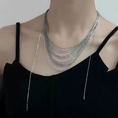 ✦ Transform your wardrobe with this Multistrand Silver Tassel Chain Necklace. Accessorize with this elegant yet simple piece for a bold and daring look. Perfect for a night out, this necklace will take your outfit to the next level. Despite the absence of diamonds, this eye-catching piece will make you shine at any party! ----------- DETAILS ----------- - Color: Silver - Materials: Brass - Necklace Length: 42.3cm - SKU: HN2699 Choker Chain Jewelry For Night Out, Trendy Lariat Choker Necklace For Party, Elegant Double Chain Necklace For Party, Trendy Dangle Necklaces For Party, Metal Choker Drop Necklace For Party, Metal Drop Choker Necklace For Party, Metal Drop Necklace For Party, Adjustable Chain Choker Necklace For Party, Multi-strand Delicate Chain Necklace For Party