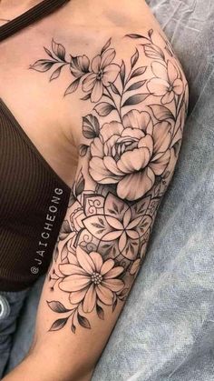 a woman with a flower tattoo on her arm