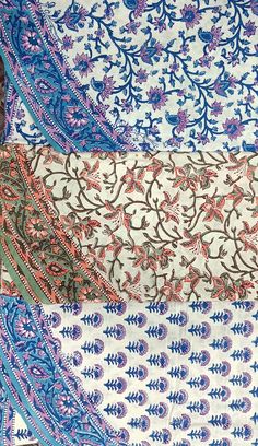 four different types of blue and pink paisley print sari fabric on top of each other