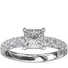 Exquisite in design, this diamond engagement ring features pavé-set diamonds complemented by platinum that beautifully frames your center diamond. Radiant Cut Diamond Wedding Ring With Accents In White, Platinum Diamond Ring With Halo Setting And Princess Cut, Platinum Princess Cut Diamond Ring With Halo Setting, White Radiant Cut Ring With Diamond Accents, Dazzling White Diamond Ring With Center Stone, White Radiant Cut Diamond Ring With Center Stone, Radiant Cut White Diamond Ring With Center Stone, White Princess Cut Diamond Ring In Platinum, White Moissanite Princess Cut Diamond Ring