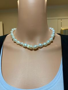 "White Flameball Baroque Pearl Necklace. This hand knotted strand features 30 White Freshwater Baroque \"Flameball\" Pearls bead nucleated AAA High Luster rose overtones Genuine and Natural 9.9X13.2 to 11.1X15.4mm. These amazing pearls are perfectly matched with very thick nacre, very few blemishes. I hand knotted this strand with white silk thread and finished it with a 925 silver magnetic clasp, the necklace measures 17 1/4 inches in length. The necklace pictured is the one you will receive. P Round Pearl Necklace With Polished Beads, High Luster Round Beads Necklace, Elegant Hand-strung Beaded Necklaces, Elegant Large Bead Pearl White Necklace, Elegant Pearl White Necklace With Large Beads, Elegant Large Beaded Pearl White Necklace, White Hand Knotted Jewelry With Round Beads, Hand Knotted White Round Bead Jewelry, Formal Necklaces With Large Beads