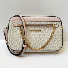 New With Tag Michael Kors Jet Set Item East West Chain Crossbody Shoulder Bag Mk Signature Pvc Leather Vanilla Pink (Powder Blush) 100% Authentic Retail: $348.00 Plus Tax *Please See The Measurement For The Size* No Dust Bag Zip Top Closure Michael Kors Logo At Front Gold Toned Hardware Custom Fabric Lining 2 Slip-In Pockets 10" (L) X 6"(H) X 2.5"(D) Strap: 20"-23" Very Clean, Smoke-Free And Pet-Free Environment. Sac Michael Kors, White Crossbody Bag, Michael Kors Crossbody Bag, Mk Bags, Pink Handbags, Powder Blush, Michael Kors Crossbody, Chain Crossbody Bag, East West