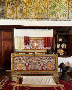 an ornately decorated chest in the middle of a room