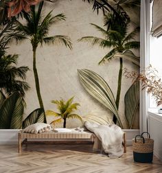 a bedroom with palm trees on the wall