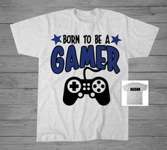 Born to Be a Gamer T-Shirt. Product Details: Infant Bodysuit 100% Cotton. Toddler Unisex T-Shirts 60% cotton 40% polyester. Youth Unisex T-Shirts 60% cotton 40% polyester. How to Order: Select from Drop down menu -Shirt Color -Size choice from drop down menu (SEE SIZE CHARTS IN IMAGES). Note in "COMMENTS TO SELLER" at checkout: -Personalization. -Color Changes (SEE COLOR CHARTS IN IMAGES). If name NOT provided, item will ship without personalization. If color changes NOT provided item will ship with colors used on sample image. Colors may vary based on monitor settings. Casual Short Sleeve T-shirt For Gaming Events, Pre-shrunk Graphic Tee For Gaming Events, Casual Tops With Letter Print For Gaming Events, Casual Top With Letter Print For Gaming Events, Casual Letter Print Top For Gaming Events, Crew Neck T-shirt For Gaming Events With Letter Print, Crew Neck T-shirt With Letter Print For Gaming Events, Crew Neck Letter Print T-shirt For Gaming Events, Girls Football Shirt