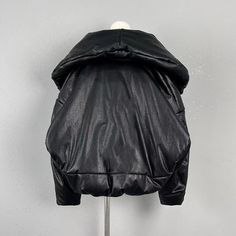 Material: Vegan Leather Hooded Black Puffer Jacket With Padded Collar, Black Urban Puffer Jacket With Padded Collar, Hooded Black Puffer Jacket For Fall, Black Hooded Puffer Jacket For Fall, Black Puffer Jacket With Padded Collar For Winter, Black Padded Collar Outerwear For Cold Weather, Black Puffer Jacket With Pockets For Fall, Black Puffer Jacket With Padded Collar For Fall, Black Fall Puffer Jacket With Padded Collar