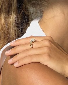 The Pearl Croissant Ring is a unique and stylish piece of jewelry. It features an oval pearl in the center, surrounded by a beautiful rope-like band. The ring is made of 18k gold plated stainless steel, making it waterproof and tarnish free. This statement ring is perfect for wearing alone or with other jewelry. It's sure to make a statement and add a touch of elegance to any outfit. Size : 6,7,8 Material : 18k gold plated sterling silver  Packed in ILLÁRI ring box  Free cleaning cloth  30 day return policy if unworn or not damaged. Rerun Shipping paid by customer Trendy Gold Pearl Ring Gift, Chic 14k Gold Open Ring Jewelry, Chic Yellow Gold Ring Jewelry, Chic Open Ring Wedding Jewelry, Chic Gold Dome Ring Open Style, Chic Gold Open Dome Ring, Chic Tarnish Resistant Ring, Chic Tarnish-resistant Ring, Elegant Gold Plated Dome Promise Ring