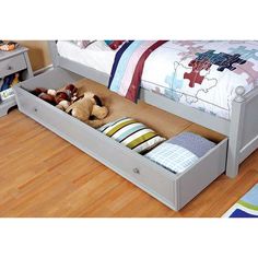 a child's bed with drawers underneath it and stuffed animals in the bottom drawer