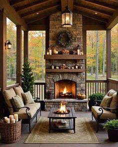 an outdoor living room with fireplace and seating