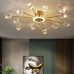 a living room scene with focus on the ceiling light and painting in the background,