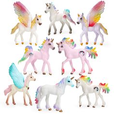 the toy horses are all different colors and sizes