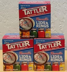 three boxes of tattler lids and rings are stacked on top of each other