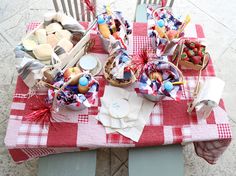 a picnic table set up with food and snacks