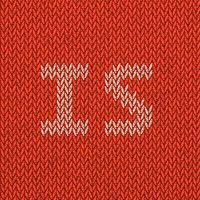 a red and white knitted sweater with the letter e on it's side